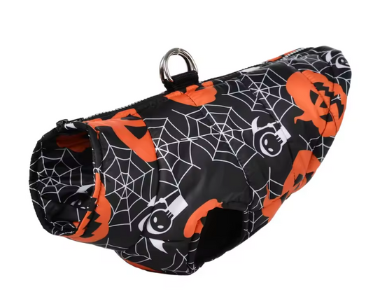 A dog coat or bag with a Halloween print, featuring orange jack-o'-lanterns and white spiderwebs on a black background, complete with a silver metal D-ring at the top.